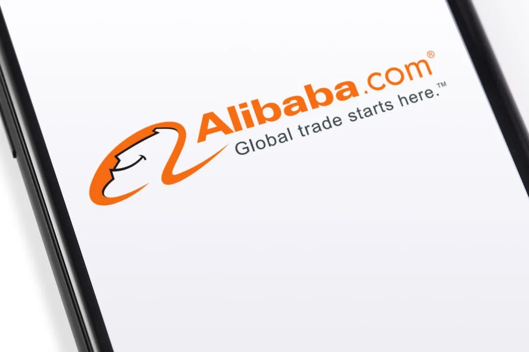 Alibaba.com logo on orange background on laptop screen