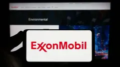 ExxonMobil (XOM Stock) Logo in red on white smartphone screen