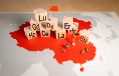 Rare earth elements over a map of China. China is the dominant global supplier of rare earths, 17 minerals that are indispensable to the manufacturing of smartphones, electric vehicles, military equip...