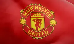 Manchester United Logo on red flag background MANU