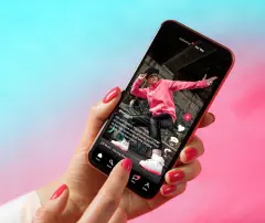 Sample social media app interface on mobile phone showing shared video content