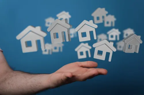 house illustrations floating above a hand