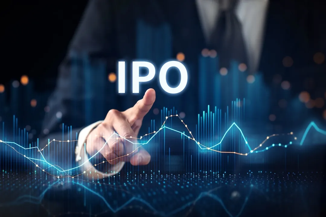 Finger pointing to glowing stock chart, letters IPO above.