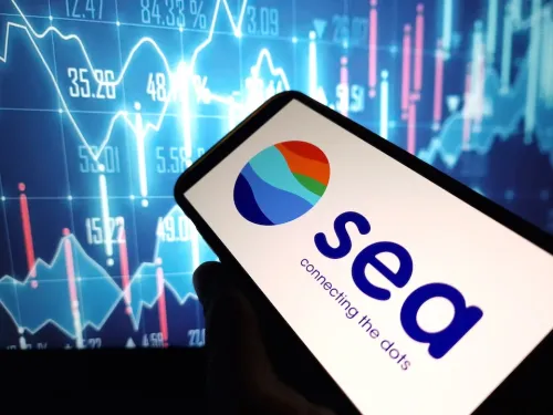 SEA ltd logo on smartphone screen, chart backdrop