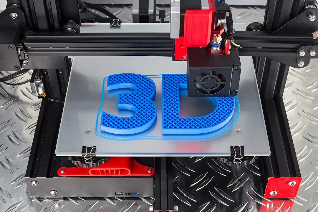 Red black 3D printer printing blue logo symbol on metal diamond plate future technology modern concept