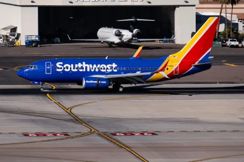Southwest Airlines Plane on runway next to hangar