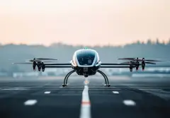 The innovative design of an eVTOL drone takes flight from the runway.