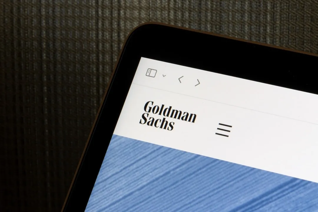 Goldman Sachs logo is seen on its website homepage on a computer. The Goldman Sachs Group is a global investment banking, securities and investment management firm.