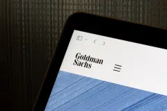 Goldman Sachs logo is seen on its website homepage on a computer. The Goldman Sachs Group is a global investment banking, securities and investment management firm.