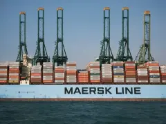 Maersk Line shipping vessel loaded with containers sails on the sea
