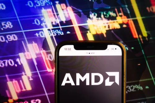 AMD Logo on Smartphone against stock charts
