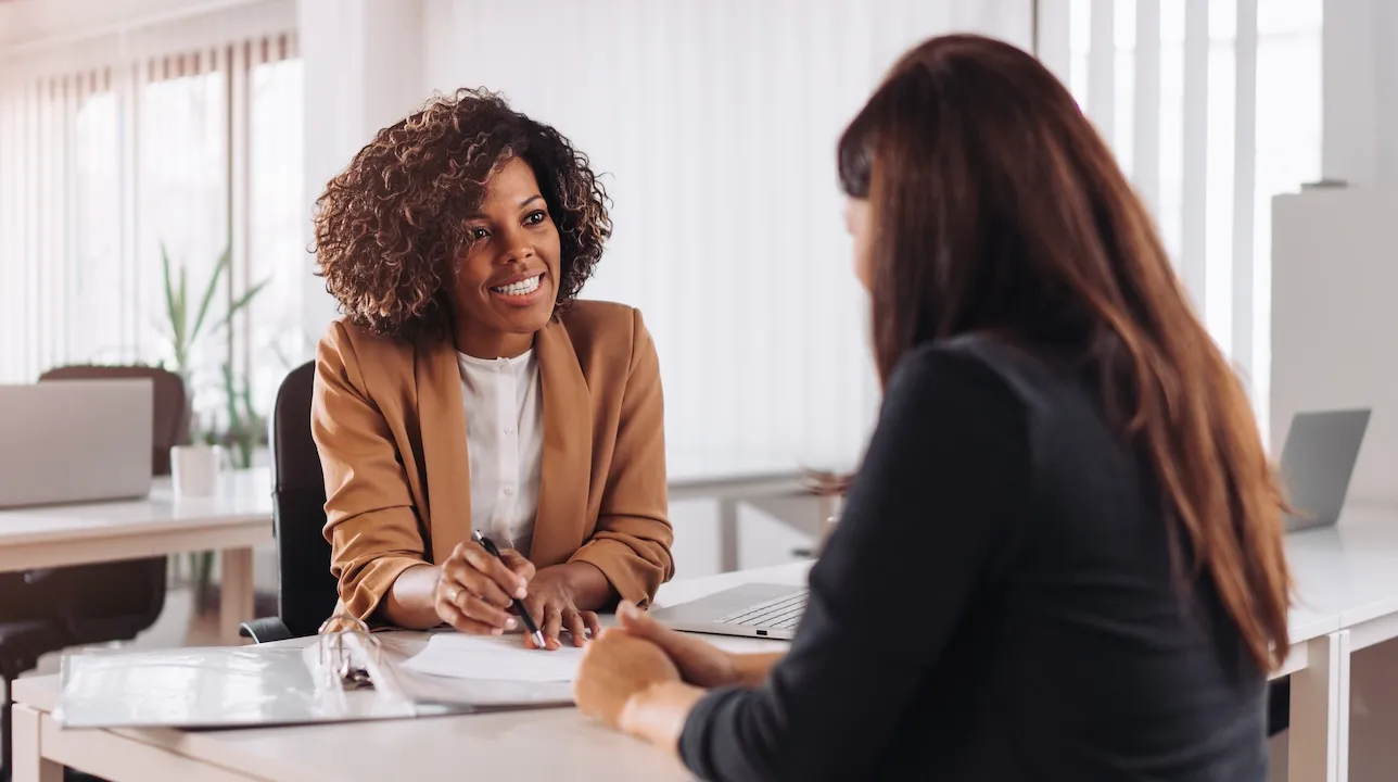 Woman consulting with a female financial manager at the bank