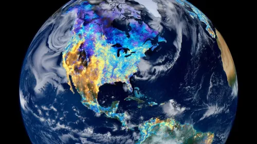 Satellite view of earth showing thermal heatmaps of carbon hot spots across continents.