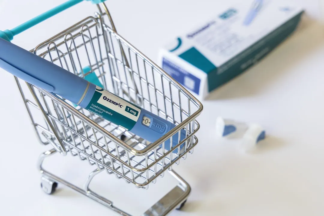 Shopping trolley holding Ozempic drug 1mg next to packet of meds