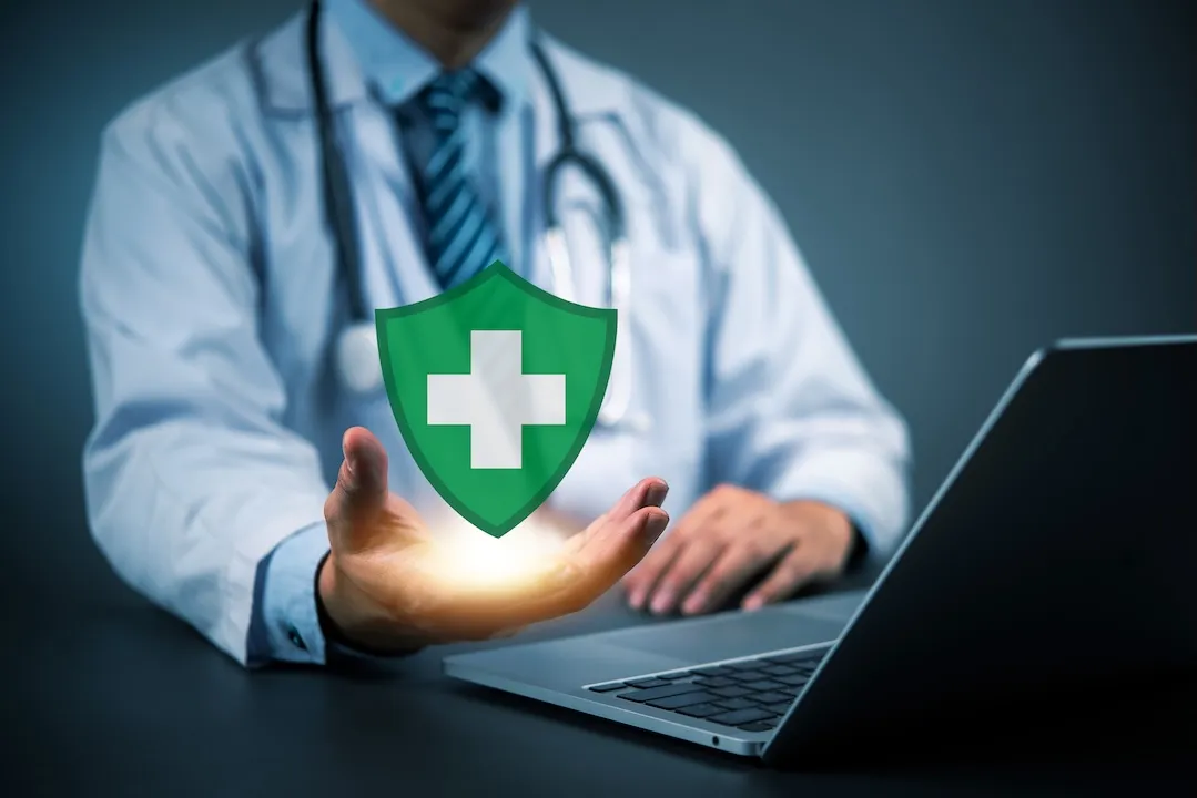 Healthcare protection concept with doctor displaying virtual shield, management secure medical insurance, data safety, and modern health security systems.digital health insurance