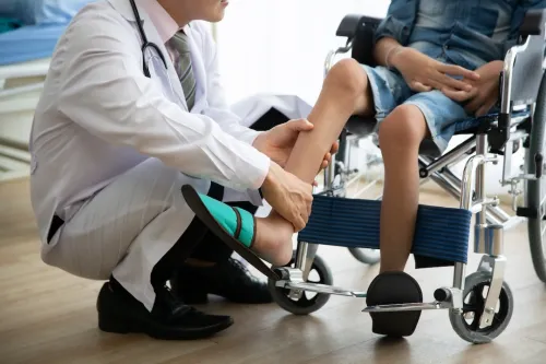 Doctor checking disabled person pateint leg at hospital, Muscle weakness