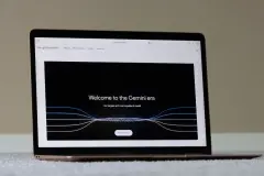 Webpage of Google's Gemini is seen on a MacBook Air laptop. Google launches its "largest and most capable" AI model, Gemini, to rival OpenAI's GPT-4.
