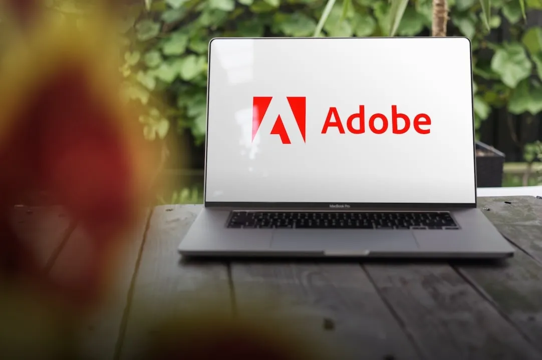 Adobe Logo on White Background on Laptop screen