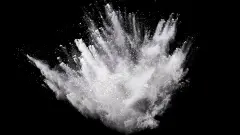White powder explosion on black background.