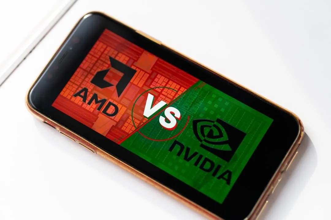 AMD Vs NVDA logos on red and green smartphone screen