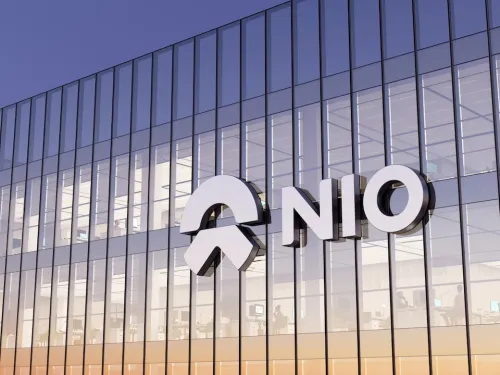 Editorial Use Only, 3D CGI. NIO Company Signage Logo on Top of Glass Building. Workplace Electric Vehicles Automaker Office Headquarters.