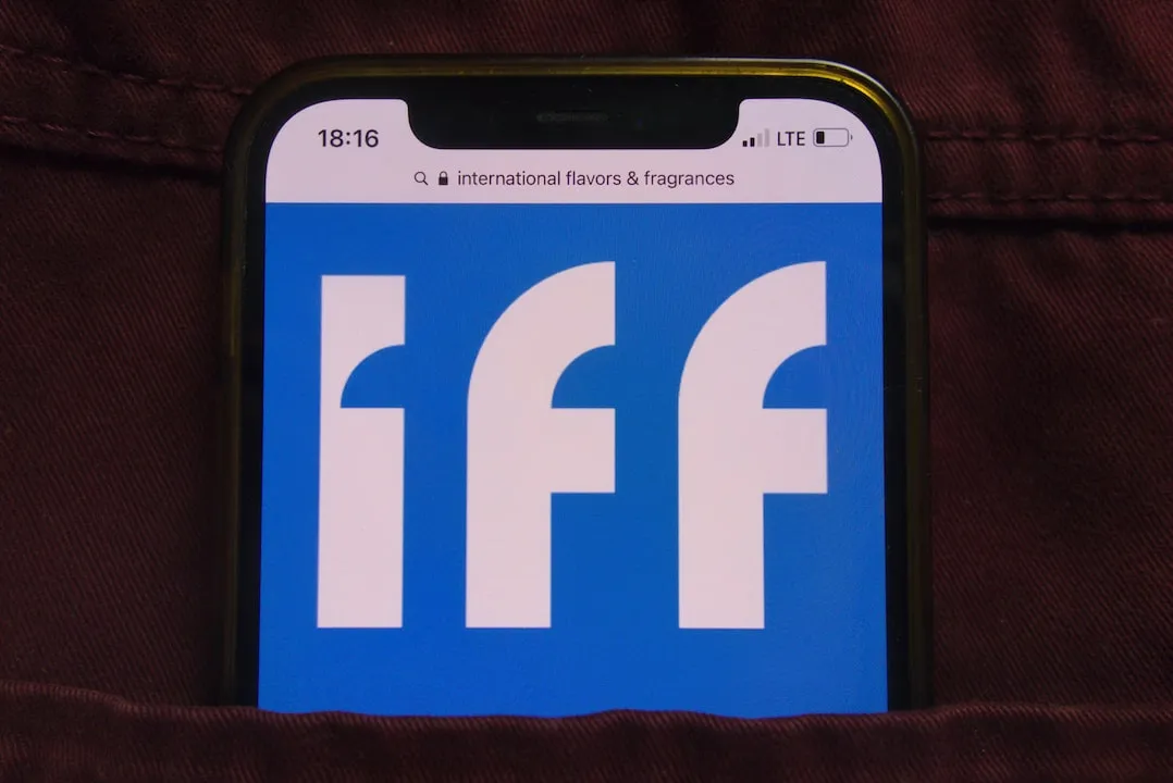 IFF Logo on a smartphone screen