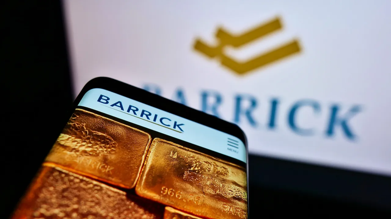 Barrick Logo on smartphone screen and behind GOLD stock