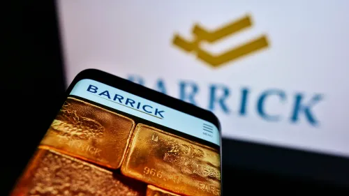 Barrick Logo on smartphone screen and behind GOLD stock