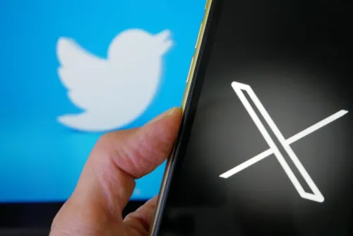 X logo on smartphone screen Twitter Bird Logo behind