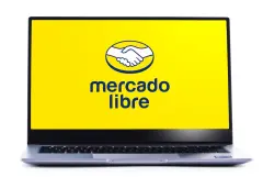 MercadoLibre Logo on yellow background on laptop screen