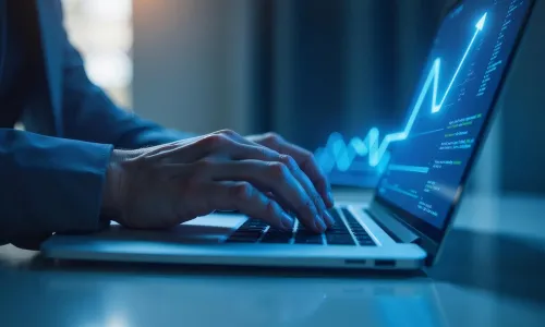 Person analyzing financial data on laptop at night.