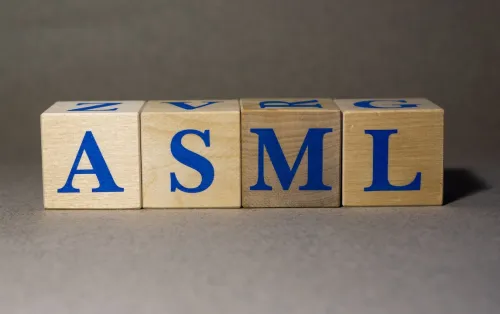 New York, USA. Exchange Ticker symbol of the company ASML Holding ASML, made of wooden cubes, on a gray background.