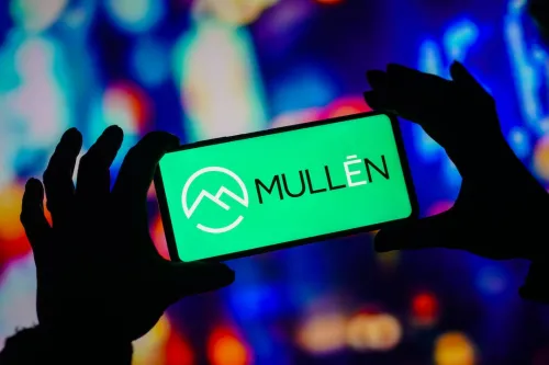 Mullen Automotive logo on hand held Digital Device