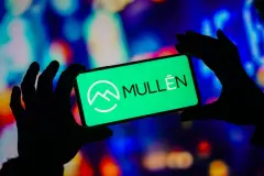 Mullen Automotive logo on hand held Digital Device