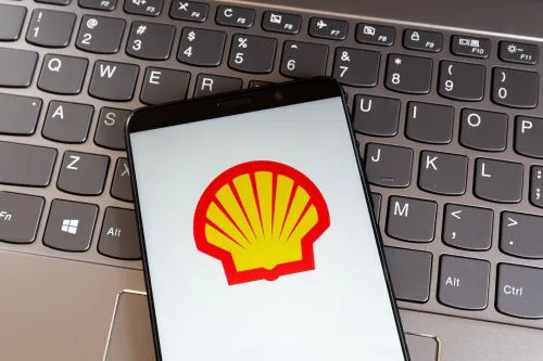 Shell Logo on Smartphone sitting on Keyboard.