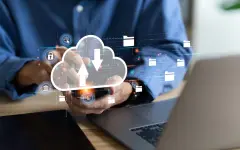 businessman uses a Laptop with technology cloud computing for data transmission, database, data storage, and backup. Networking and internet service concept. Futuristic business network