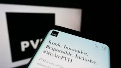 Calvin Klein Owner PVH  Cellphone with webpage of US clothing company PVH Corp. on screen in front of business logo. Focus on top-left of phone display.